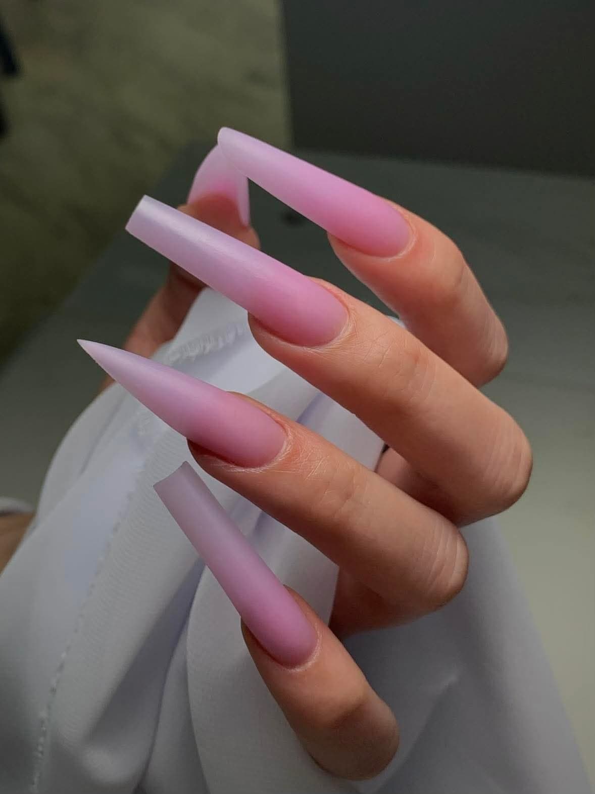 Long matte pink nail extensions
